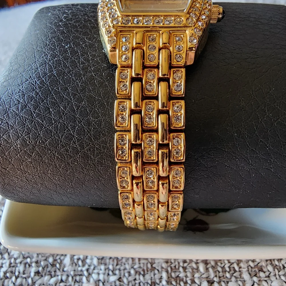 Vintage Nolan Miller crystal gold-tone watch.